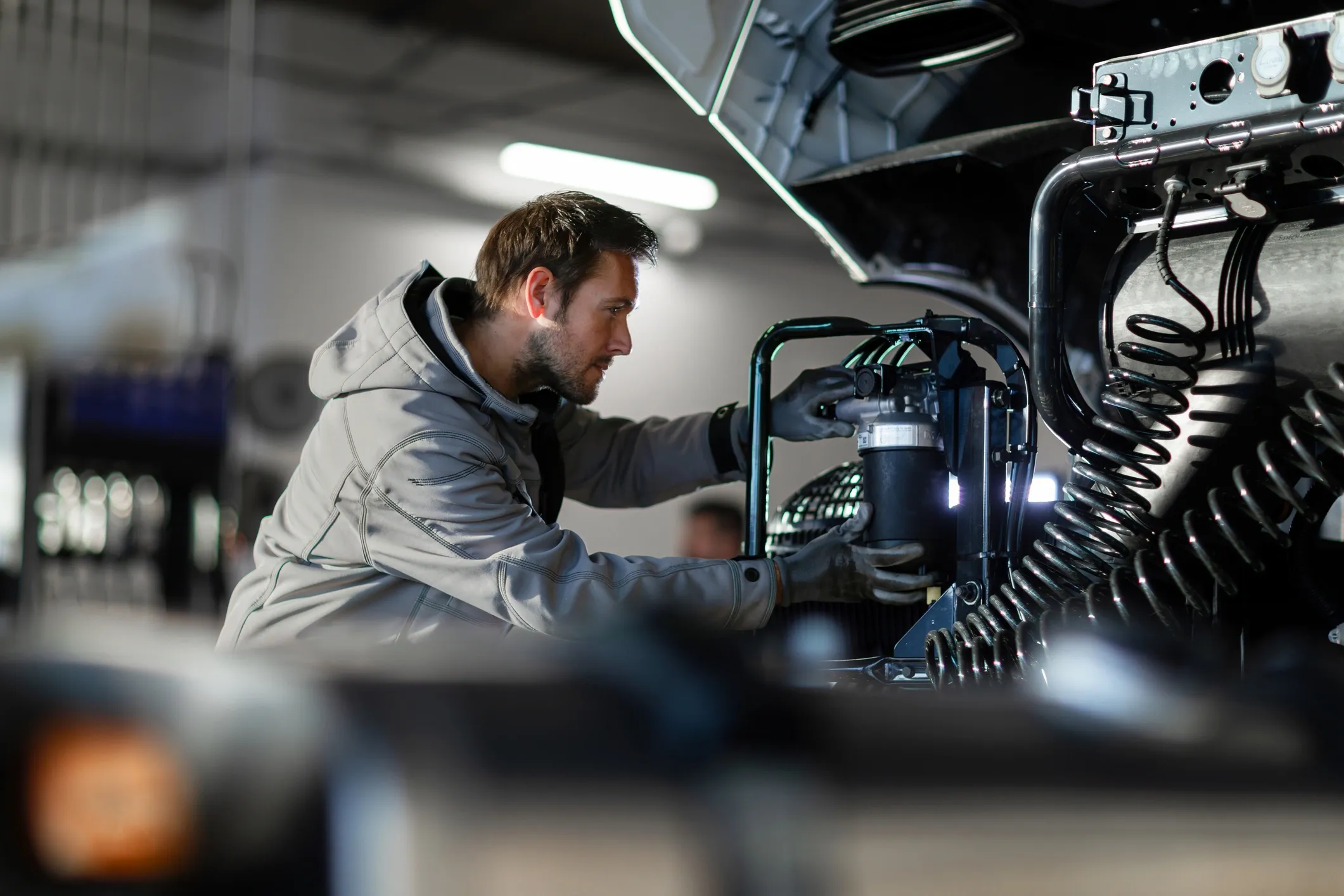 Creative Car technician servicing a vehicle